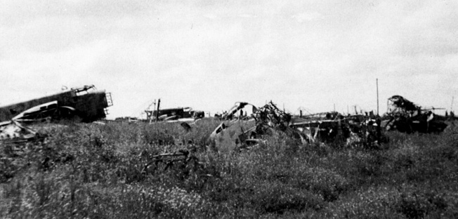 In the wake of a raid by the Long Range Desert Group (LRDG), destroyed Italian aircraft litter the airfield at Barce, Libya. An attack by the LRDG on September 13, 1942, left 30 Italian planes destroyed and impeded the delivery of supplies to Axis forces.