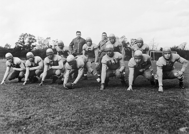 During a time when the U.S. military was segregated, American service personnel stationed in Great Britain formed a football team that included both black and white players. The U.S. military was desegregated in the late 1940s.