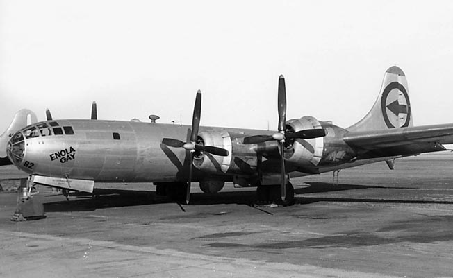 The B-29 Superfortress Enola Gay, named for the pilot’s mother, is shown parked on an unidentified airfield.