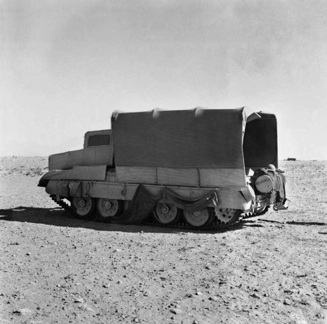 Photographed in June 1942, this Crusader tank has been fitted with the sunshield camouflage scheme to resemble a truck. Early testing of the sunshield system was highly successful.