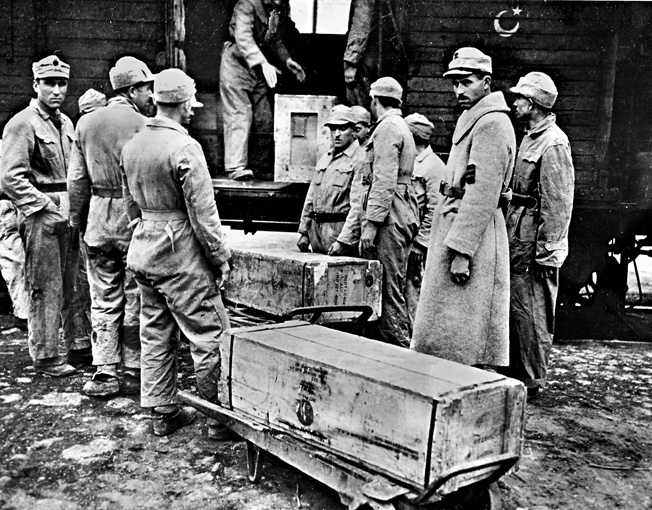 Although Turkey did not officially join the Allies until the spring of 1945, the nation did receive large amounts of war matériel and supplies through Lend Lease. In this photo, Turkish soldiers unload American-made bombs and other ordnance at Port Iskenderun, Turkey.