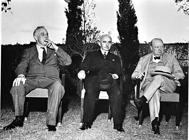 U.S. President Franklin D. Roosevelt (left), Turkish President Ismet Inönü (center), and British Prime Minister Winston Churchill (right) pose for photographers during a 1943 conference during which they discussed matters of mutual importance. 