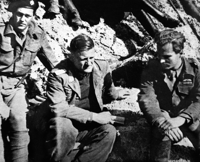 General Kreipe (center) is shown talking with Leigh-Fermor (right) of the British SOE following his kidnapping.