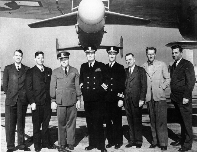 The BAT development team included a number of scientists and designers, such as, left to right, R.C. Newhouse, H.K. Skramstead, O. McCrackin, D.P. Tucker, L.P. Tabor, Dr. Hugh L. Dryden, Hunter Boyd, and Ralph Lamm.