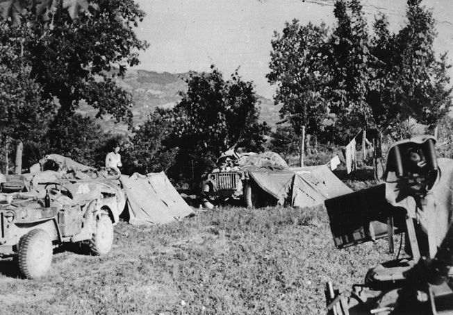 The fighting men of Popski’s Private Army were experts in hit-and-run tactics. One of their camps is shown in Italy late in the war as preparations are made for the departure of a patrol. 