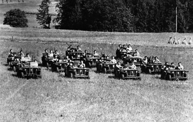 Mounted aboard jeeps in classic style, a patrol of Popski’s Private Army moves across an Austrian meadow in September 1945. After the war officially ended, it remained necessary to keep perimeters secure and maintain order and discipline among the military and civilian populations.