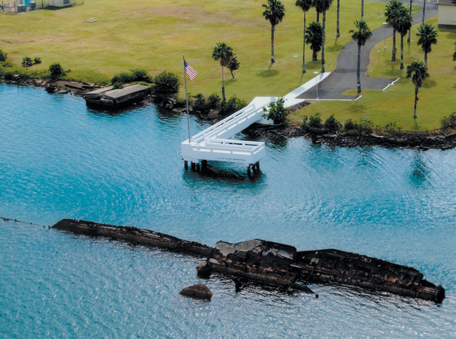 Overshadowed by the stately memorial to the USS Arizona less than a mile away, the simple memorial constructed at the grave of the USS Utah in 1972 commemorates the 54 sailors who lost their lives aboard the vessel on December 7, 1941.