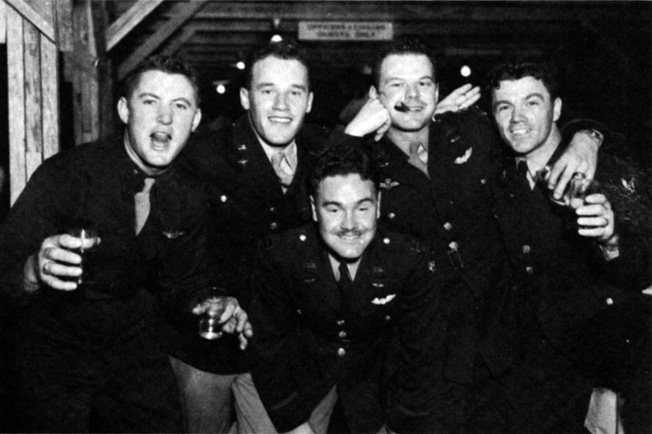 Before heading overseas in March 1944, pilots of the 406th Fighter Group enjoy a farewell party. From left, Lt. Dudolski, Lt. Hughes, Cptn L.C. Seldeon, Ctptn Dunn, and Lt. Marusiack.
