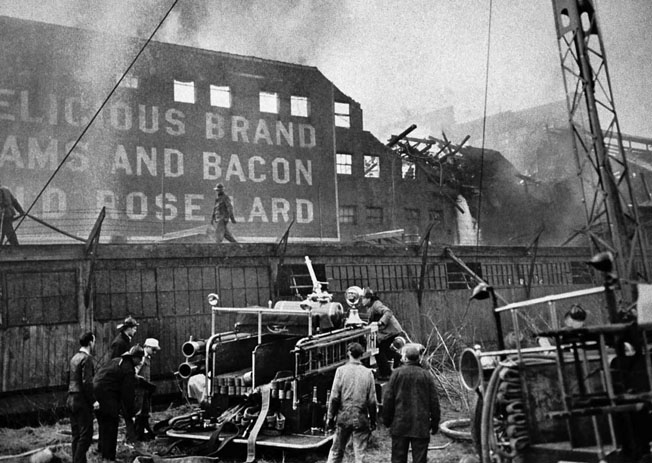 The top-secret prototype of a Boeing B-29 crashed into Seattle’s Frye Meat Packing Plant due to an engine fire, February 18, 1943. Eleven Boeing personnel died along with 20 on the ground.