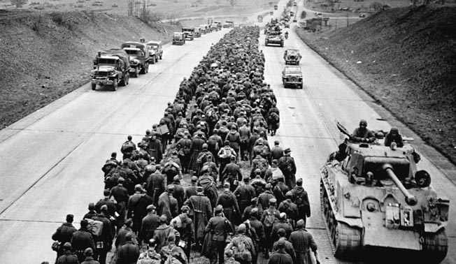 Hordes of German prisoners head west into captivity along the autobahn, while American tanks and infantry advance east. After the war, Miller literally gave the shirt off his back to a German POW, with surprising consequences. 