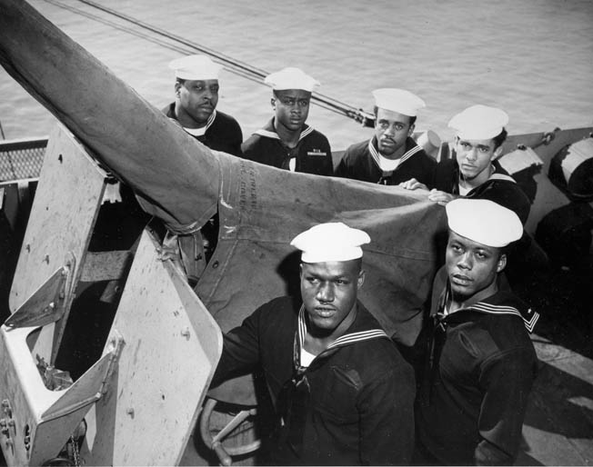 Crewmen of the USS Mason pose by one of the ship’s deck guns. The ship was primarily involved in the dangerous business of convoy escort duty in the Atlantic. 