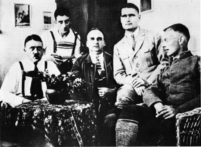 While serving sentences in Landsberg Fortress prison for the 1923 Putsch, Hitler (left) and Hess (second from right) pose with fellow Nazi prisoners.
