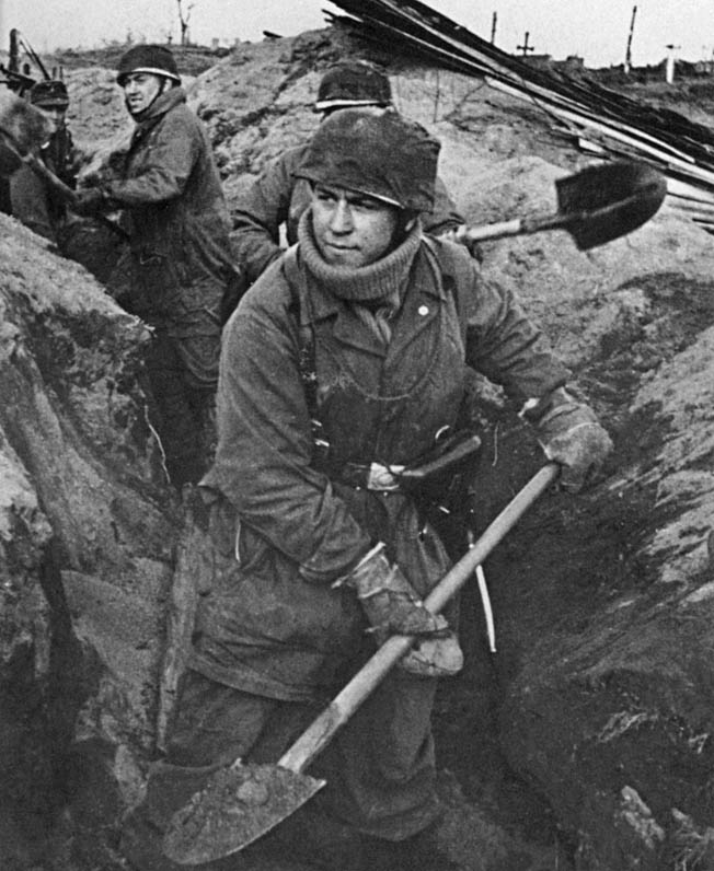 Life wasn’t all glamour for elite parachutists. Here Fallschirmjägers dig a defensive position in frozen Soviet soil after the 1941 invasion of the U.S.S.R. Statetzny survived the fighting there, and he and his unit were sent back to Germany for rest, refitting, and more training.