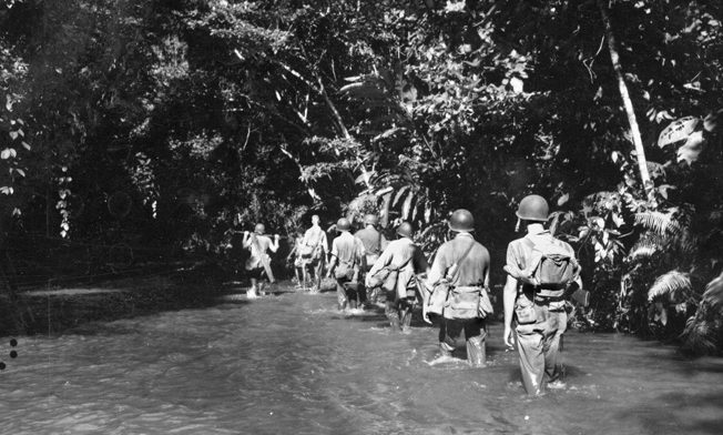 A Marine patrol follows the Tenaru River on the northern coast of Guadalcanal as they search for elusive Japanese artillery pieces. 