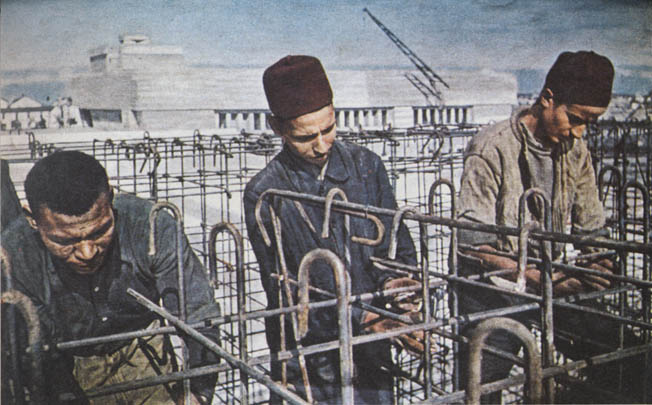 More than a quarter million foreign workers, such as these Turks tying together reinforcing steel bars, provided much of the manpower to construct the fortifications. 