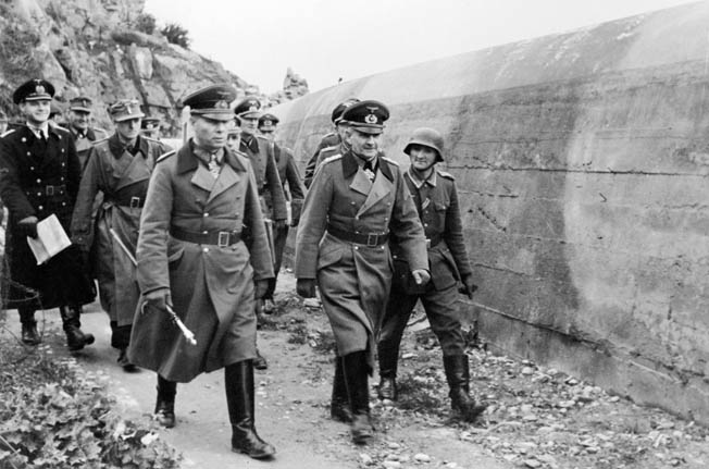 After Field Marshal Erwin Rommel (with baton) was appointed to command Army Group B in late 1943, he had responsibility for defending 1,300 miles of coastline. 