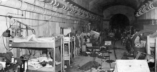 Even reinforced concrete several yards thick was often an insufficient defense. Here, several German soldiers lie dead inside the underground sleeping quarters at the Cherbourg fortress, June 27, 1944.