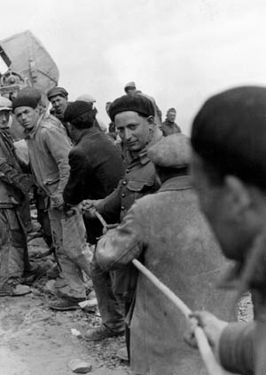 Not all the workers were willing. Here, conscripted laborers from a German-occupied country are put to work in May 1942.