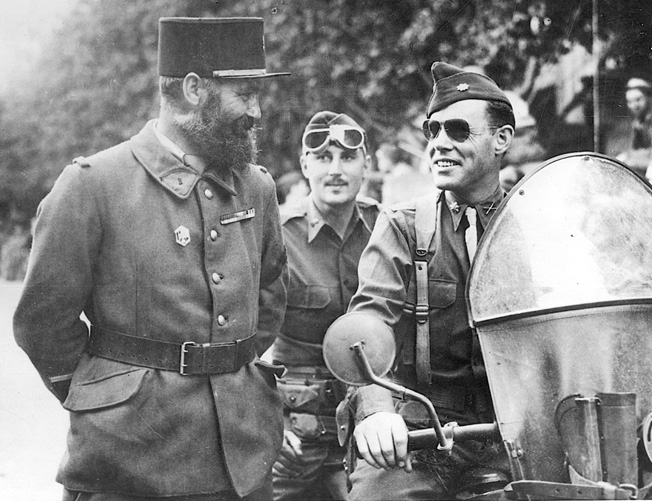 Lt. Col. William Darby (right) talks with French soldiers wearing the distinctive kepi and a full beard at the height of the campaign against the Germans in North Africa, December 18, 1942.