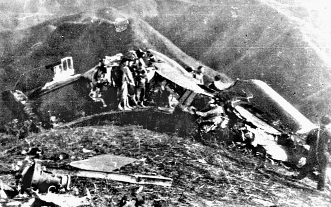 Wreckage of Doolittle’s plane on a Chinese hillside. Doolittle can be seen center right.