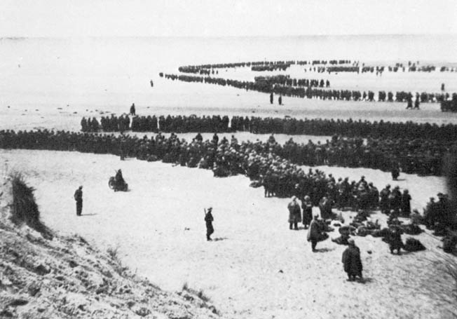 Dunkirk, late May 1940: British and French troops await evacuation to Britain. Churchill opined, “We must be careful not to assign to this deliverance the attributes of a victory. Wars are not won by evacuations.” 