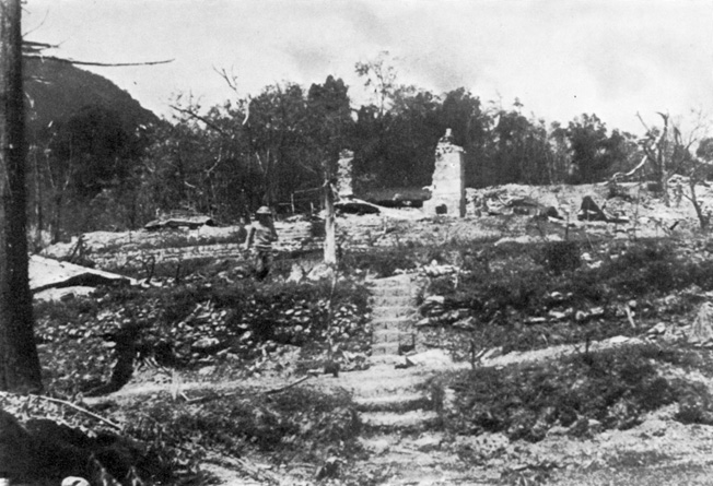 The ruins of the district commissioners bungalow at Kohima bear mute testimony to the savagery of the fighting combat took place in such a close quarters that bitter fighting raged over control of a tactically vital tennis court.