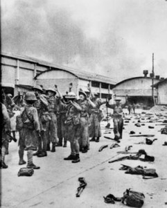 After being ordered by Percival to cease resistance, British soldiers surrender in Singapore on February 15, 1942. Many were sent to slave-labor work camps.