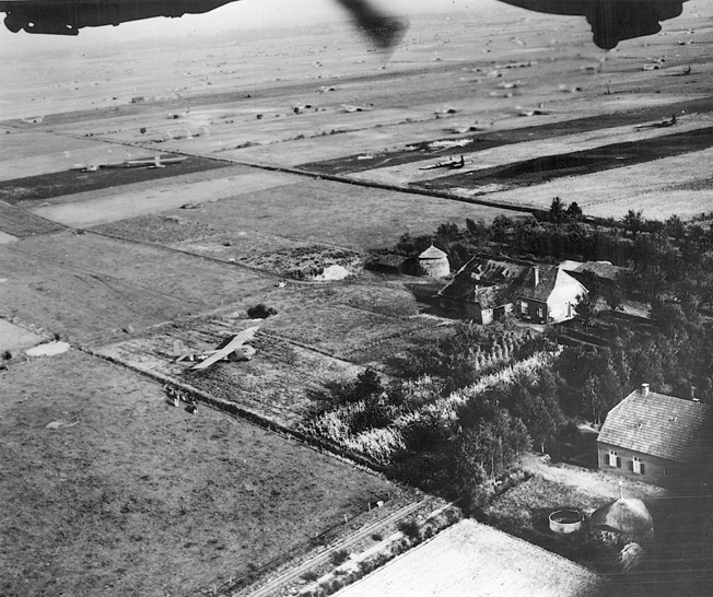 Consolidated B-24 Liberator bombers of the U.S. Army Air Forces fly over the Market-Garden glider landing zones in Holland while on their way to bomb a distant target on September 18, 1944.