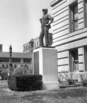 The statue of Marine Lieutenant John V. power stands larger than life on the lawn in front of City Hall in Worcester, Massachusetts.