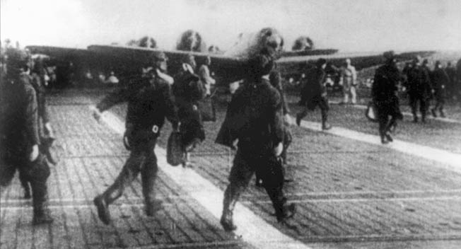 Japanese airmen take to their planes for “Operation Hawaii,” the attack on Pearl Harbor. The Japanese fleet sailed through storm and fog across the North Pacific and away from the normal sea lanes to arrive undetected 200 miles from Hawaii early on the morning of December 7.