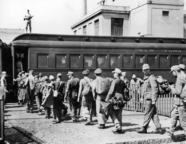 German POWs, still in their uniforms, board a train in Boston en route to a prison camp. About 425,000 German prisoners of war were held in 700 camps in 46 states. There were also camps for Italian and Japanese prisoners. Overall, POWs in the U.S. were well-treated and well-fed. 