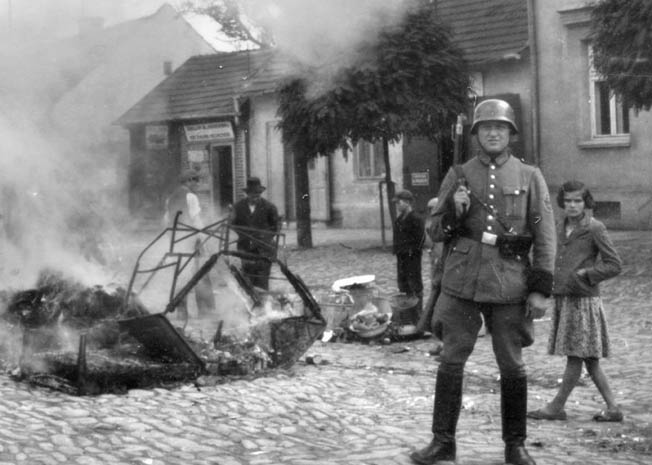 The Poles were frequent targets of German brutality during World War II; however, the occupiers saved their most horrific actions for the Jews. In this poignant photo, furniture taken from a Jewish home is burned in the street in the town of Myslenice.