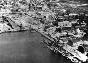 In this 1945 photograph, the devastation wrought by Allied bombers in repeated aerial assaults is evident at the Wilhelmshaven shipyard.