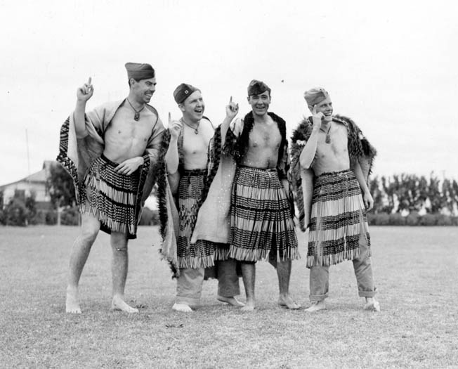 Marines try their version of a Maori war dance, contorting their faces in the spirit of the native tradition. 