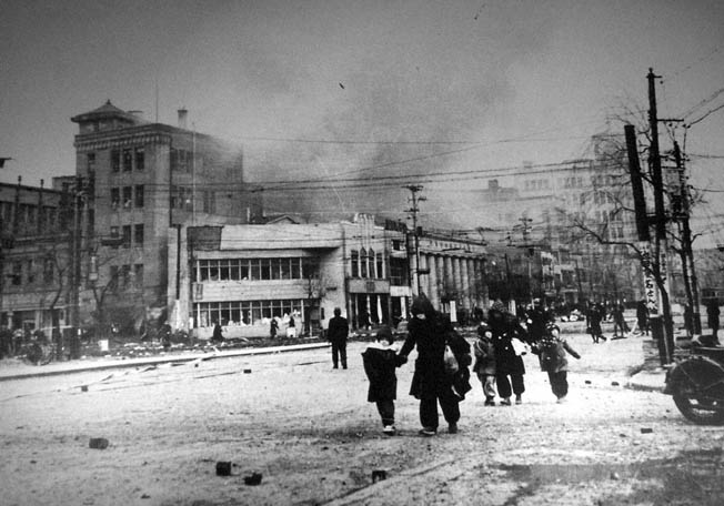 Tokyo residents flee the flames in the Ginza District.