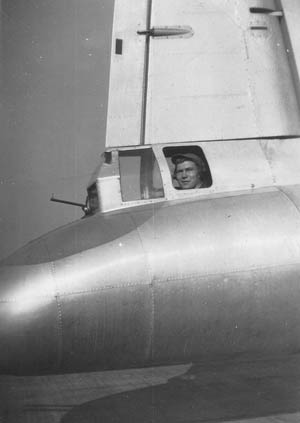 Wilbur “Bib” Bowers survived 30 missions in a Boeing B-17 Flying Fortress bomber during World War II. The average service expectancy of an American bomber crewman was significantly shorter. Bowers is shown in this photograph in the tail gunner position aboard a B-17. The small barrel protruding in front is the sight. The actual twin .50-caliber machine guns were positioned below him. 