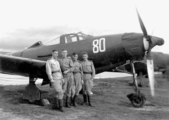 Several Red Air Force pilots stand with a Bell P-39 Airacobra fighter plane. The P-39 was supplied by the United States through Lend-Lease, and though it was a disappointment in most dogfighting scenarios it proved a robust ground attack aircraft.