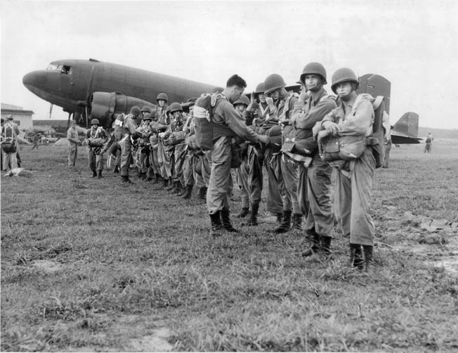 During ceremonies at Fort Benning, Georgia, 20 enlisted men and two officers of the 1st Canadian Parachute Battalion receive their coveted silver wings, which designate them as qualified jumpers and graduates of the U.S. Army parachute school. 