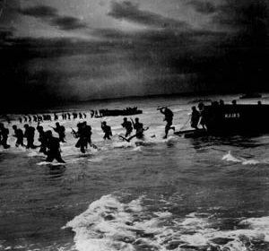 Landing craft unload their cargoes of U.S. Army troops on the beach in North Africa during the opening hours of Operation Torch on November 8, 1942. These troops are coming ashore south of Port Lyautey, where heavy surf played havoc with the initial landings, damaging numerous landing craft and disrupting the timetable for the movement inland toward the earliest Torch objectives.